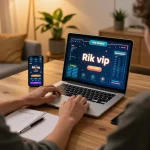 Engaging in online gaming with Rik vip on laptop, showcasing a cozy home setup with a notepad of strategies